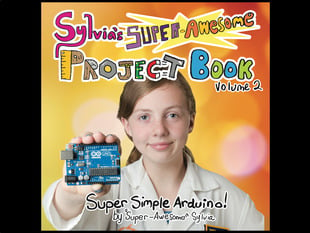 Sylvia's super awesome project book volume 2. Super simple Arduino by "Super-Awesome" Sylvia. A young white girl with reddish-brown hair tied back. She wears a white lab coat and holds up a blue dev board, an Arduino Uno.