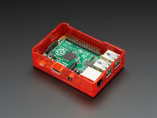 Assembled red acrylic Raspberry Pi case with no lid.