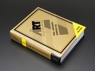 Angled shot of hardcover "The Art of Electronics 3rd Edition" by Horowitz & Hill