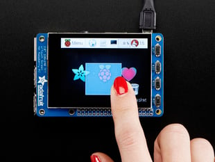 Red polished nail touching the screen of a Adafruit PiTFT Plus 320x240 2.8" TFT + Capacitive Touchscreen. 