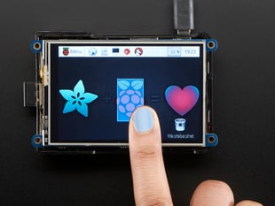 Blue polished finger touching the PiTFT Plus 480x320 3.5" TFT+Touchscreen for Raspberry Pi. 