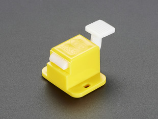 Angled shot of a yellow Fixture Clip. 
