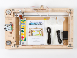 Kit content shot with watercolor drawing robot, power supply, water colors, etc.