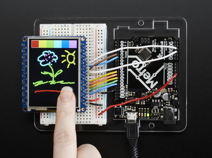 TFT breakout wired to arduino, hand doodling of a flower and a sun using touchscreen