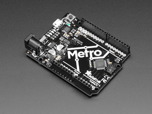 Angled shot of black and white microcontroller.