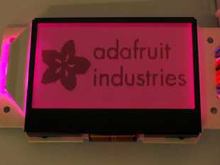 Graphic LCD showing Adafruit logo with pink backlight