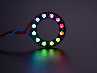 NeoPixel Ring with 12 x 5050 RGBW LEDs lighting up rainbow and white