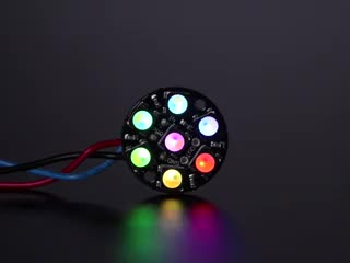 NeoPixel Jewel - 7 x 5050 RGB LED wired to Trinket, lit up rainbow and white