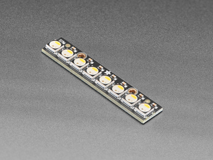 Angled shot of long rectangular PCB with 8 NeoPixel LEDs
