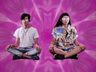 Two people meditating with trippy background