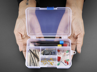 Two hands holding Latching 5-Compartment Storage Box full of assorted components