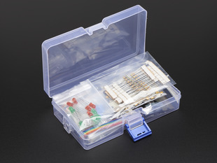 A plastic storage box full of various electrical components.