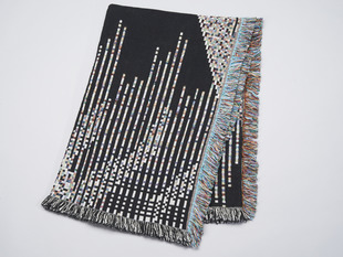 Black blanket with multicolored fringe and glitch pattern