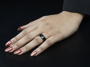 Female hand with ring on ring finger