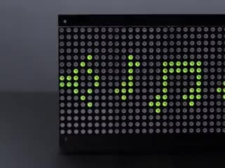 Scrolling video of powered on 32x16 Red Green Dual Color LED Dot Matrix - 7.62mm Pitch. The matrix display has red and green music notes and Adafruit and a heart symbol.