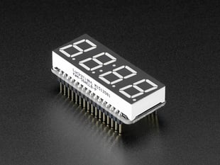 Angled shot of a rectangular shaped 7-segment breakout board with an LED matrix soldered on.