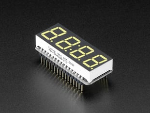 Angled shot of a rectangular shaped 7-segment breakout board with an LED matrix soldered on.