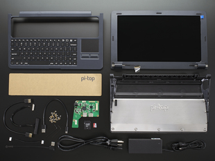 Un-assembled laptop kit with components, cables, and laptop body