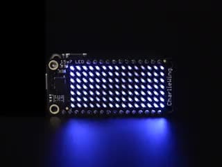 Video of a Adafruit 15x7 CharliePlex LED Matrix Display FeatherWing illuminating Blue LEDs in a wave like pattern. 