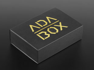Angled shot of a black box with Yellow "ADABOX" texted logo.