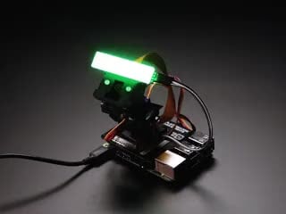 Video of an assembled and powered on Pimoroni Pan-Tilt HAT. It swings back and forth with an intense LED gar.