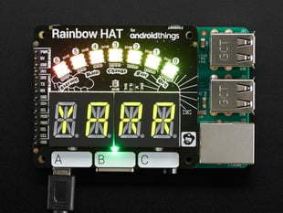 Top view of a Pimoroni Rainbow HAT connected to a Raspberry Pi. HAT reads "YARR" 
