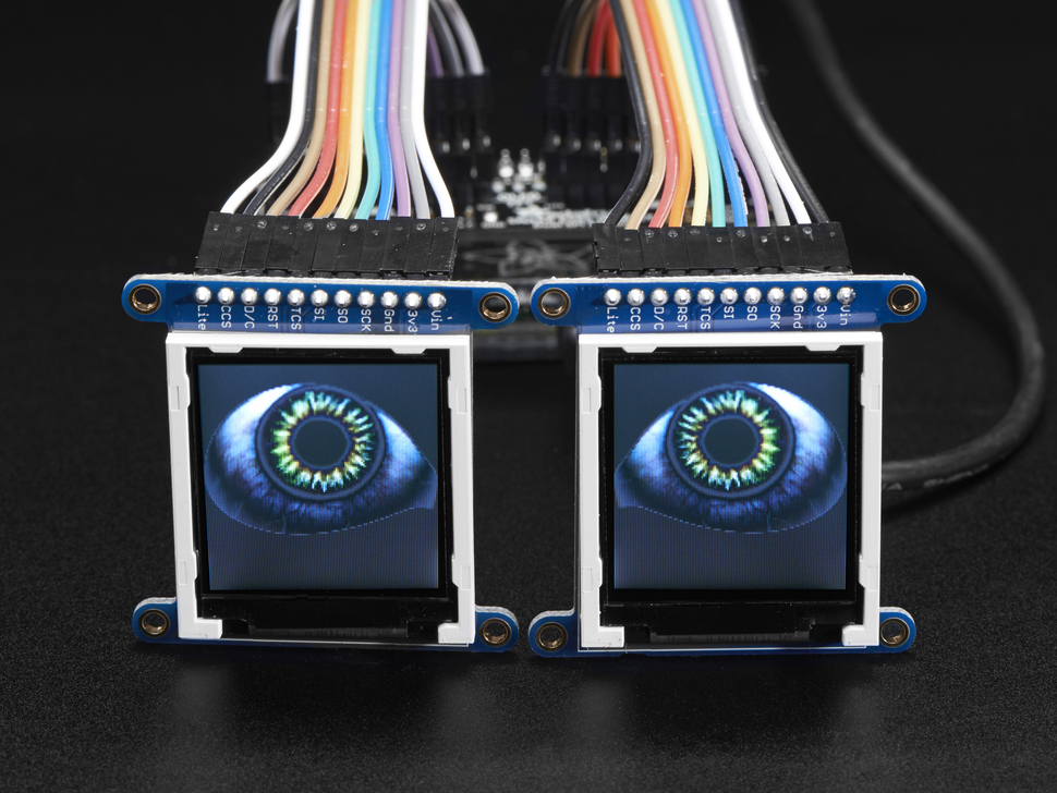 Front view shot of 2 displays showing a set of eyes.