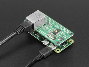 Angled shot of a PiJack Ethernet HAT for Pi Zero stacked on a Pi Zero. 