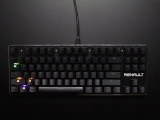 Topdown shot of mechanical keyboard with LED backlights glowing in sequence.
