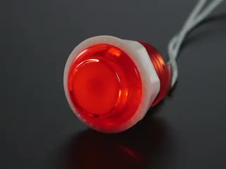 Video of 24mm mini translucent red LED arcade button flashing on and off.