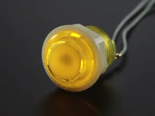 Video of 24mm mini translucent yellow LED arcade button flashing on and off.