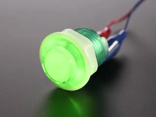 Video of 24mm mini translucent green LED arcade button flashing on and off.