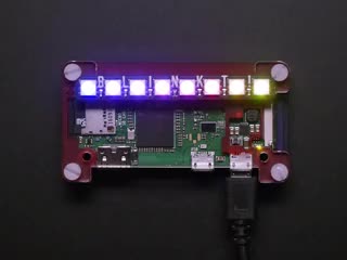 Video of assembled and powered on Pimoroni Pi Zero W Starter Kit. An LED bar glows a rainbow gradient.