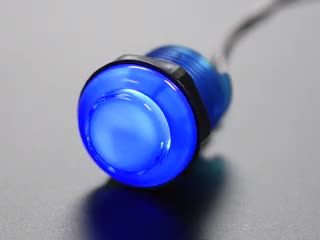 Video of 30mm translucent blue LED arcade button flashing on and off.