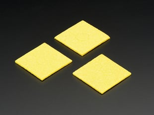 Three yellow sponges