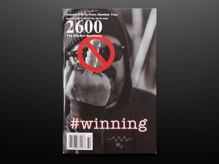 Front cover of 2600: The Hacker Quarterly - Summer 2017. #winning. Black and white photograph of a middle-aged white man in a beanie hat and hoodie holding up his middle finger, which is blurred out.