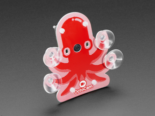 A red octopus with suction cups on its tentacles and a Raspberry Pi camera for a mouth.