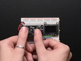 Video of a white person's hand pressing various buttons on a DIY gaming controller PCB.