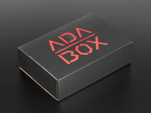 Angled shot of a black box with Red "ADABOX" texted logo.