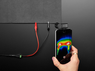 High-Conductivity Heater Fabric powered, with thermal camera showing heated area