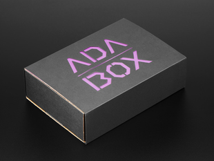 Angled shot of a black box with Purple "ADABOX" texted logo.