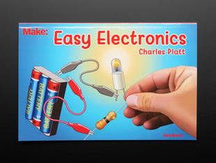 Front cover of "Easy Electronics" by Charles Platt. Closeup of a hand attaching an LED to a battery pack.