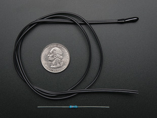 Black wire with epoxy nub end, plus a resistor, coiled around a quarter