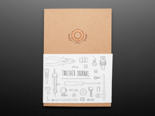 Front cover of Toolshed Journal with slipcover featuring many tool drawings