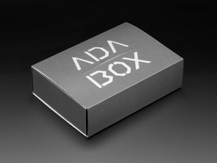 Angled shot of a black box with White "ADABOX" texted logo.