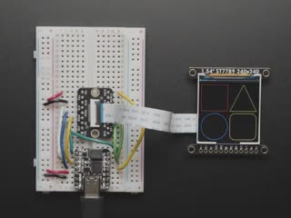 Overhead video of OLED breakout wired up on breadboard to QT Py and BFF driver board. Video displays multi-colored shapes and animations.