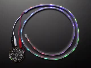 Adafruit NeoPixel LED 1 meter Strip with Alligator Clips wired to Circuit Playground, lighting up rainbow