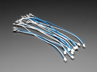 Angled shot of ten ~8.5" long quick-connect wire pairs in white and blue. 