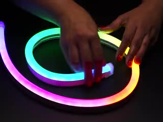 Hand flexing NeoPixel RGB Neon-like LED Flex Strip with Silicone Tube