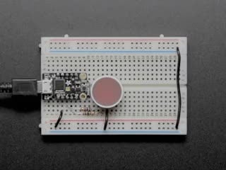 Indicator LED wired to Arduino on breadboard and pulsing red and green
